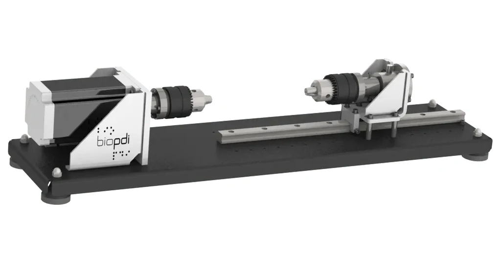 Máquina de ensaio de torção Biopdi versão Básica, com motor, dois mandris e trilho sobre base preta